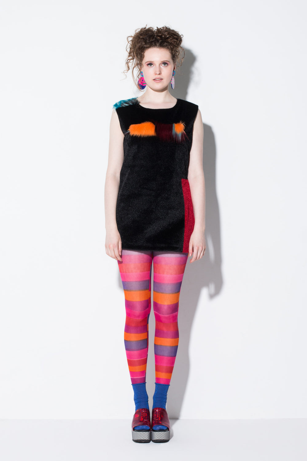 day meets night|a key piece faux fur mid-length vest in black orange and blue colour-way from jin & yin front view